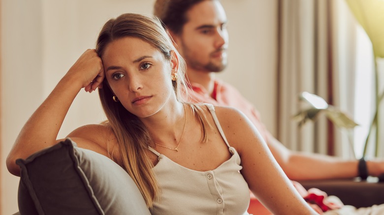 Sad couple facing away