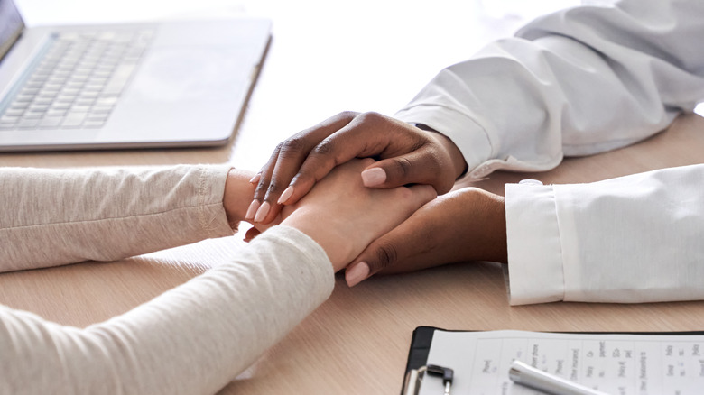 woman waiting with her doctor 