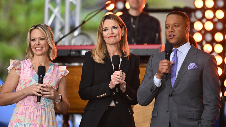 Dylan Dreyer, Savannah Guthrie, and Craig Melvin on stage performing for a crowd