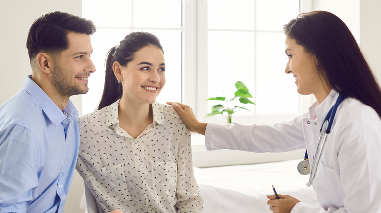 Couple speaking to doctor