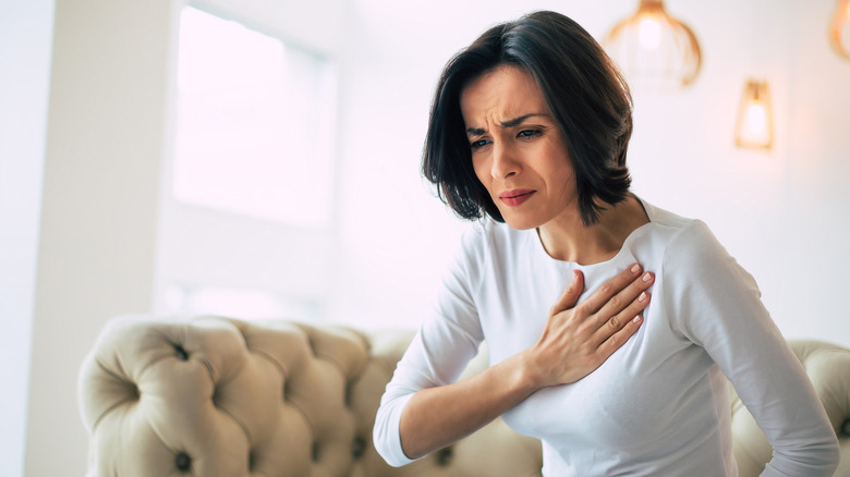 Woman having chest pain