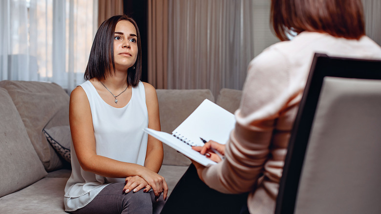 Woman speaking to therapist