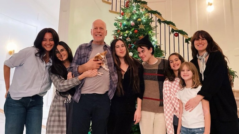 Bruce Willis posing with his family