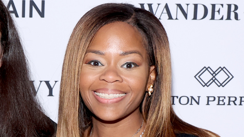 Close up of Sheila Cherfilus-McCormick in front of a white backdrop.