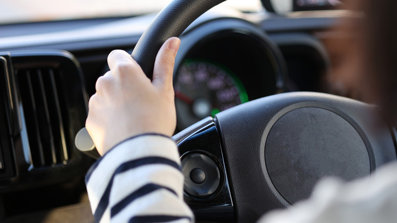 Woman's hands driving 