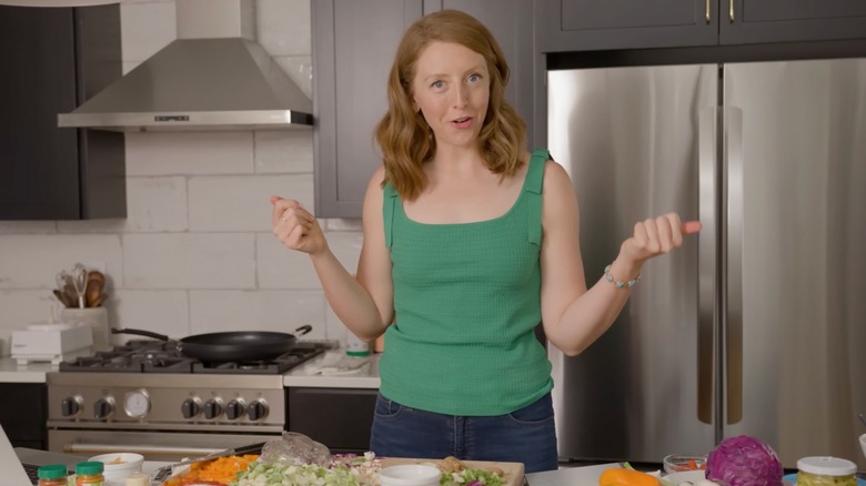 Casey Means prepping a recipe in her kitchen