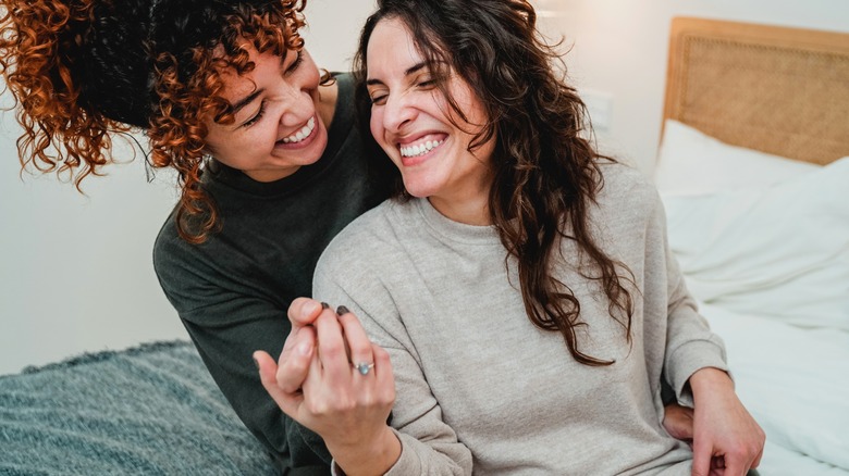 two women laughing together