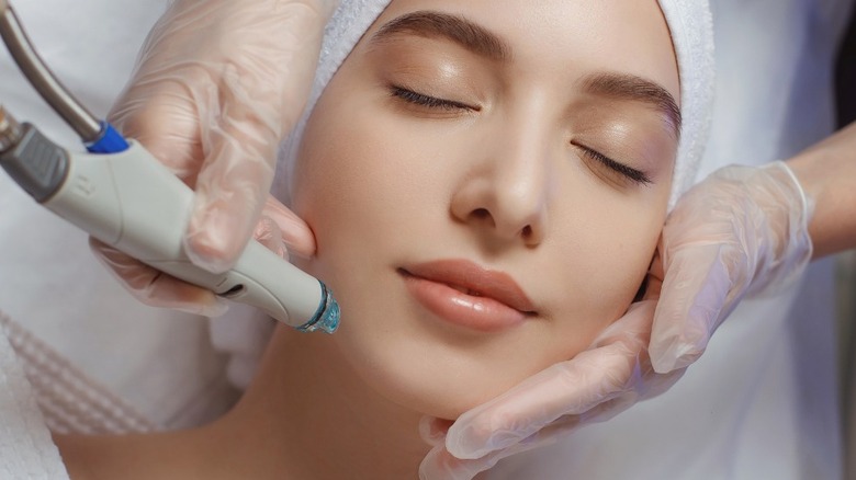 women getting face laser treatment