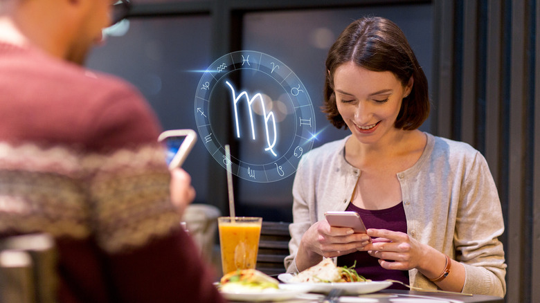 Couple in restaurant with zodiac