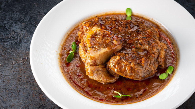 Osso buco in white dish