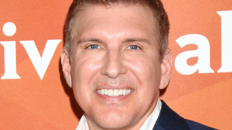 Todd Chrisley smiling on red carpet