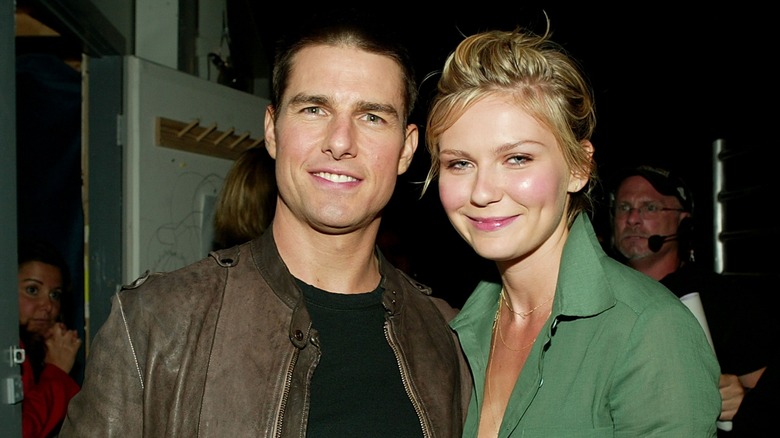 Kirsten Dunst and Tom Cruise smiling at the MTV Movie Awards