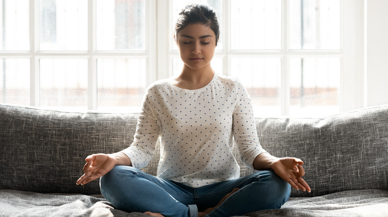 Young woman practicing transcendental meditation