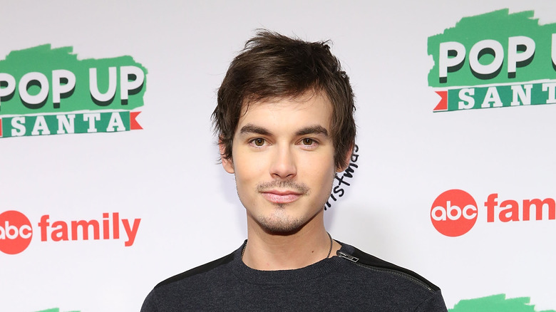 Tyler Blackburn at a red carpet premiere