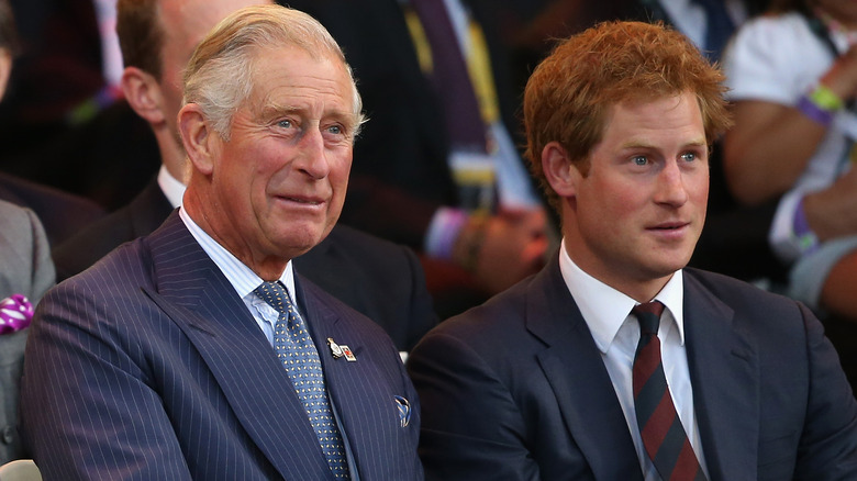 Prince Charles and Prince Harry sitting