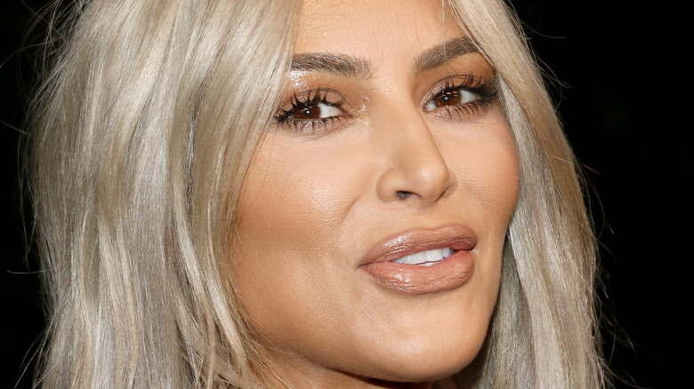 Kim Kardashian smiles for the camera.