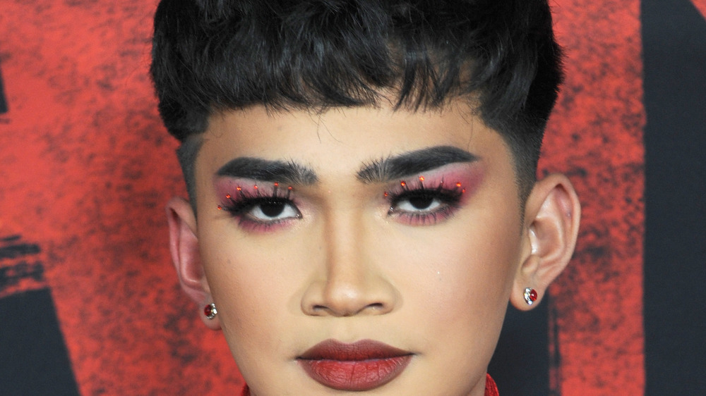 Bretman Rock, red lipstick, purple eye shadow