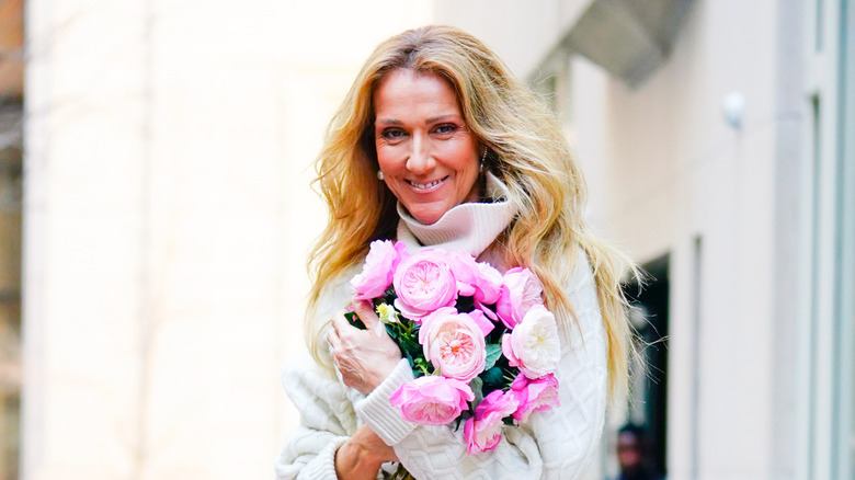 Celine Dion holding roses