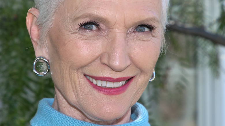 Maye Musk wears blue and smiles