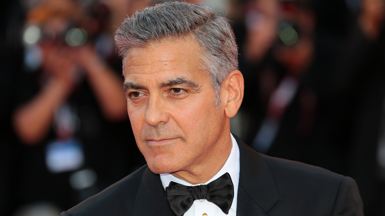 George Clooney looking side in suit