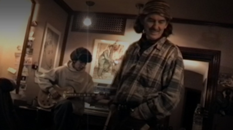 Dhani Harrison and George Harrison in the family music studio.