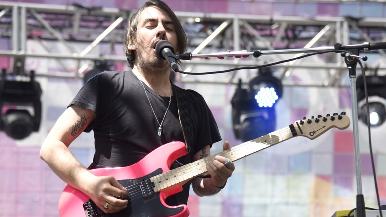 Dhani Harrison playing guitar