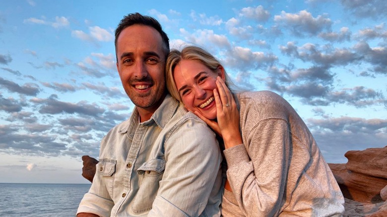 Dustin Keating and Brittany Bristow smiling in nature