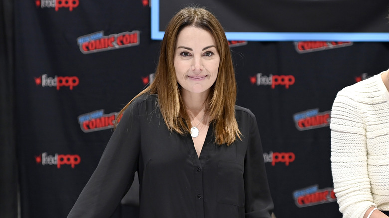 Erica Durance posing at Comic Con 2022