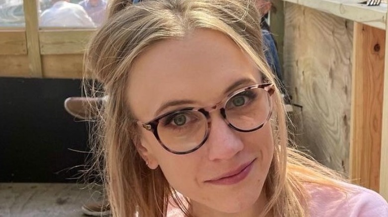 Kat Timpf in a pink sweatshirt