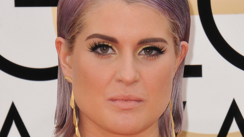 Kelly Osbourne posing