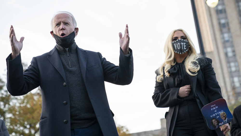 Lady Gaga and Joe Biden outside wearing face masks 