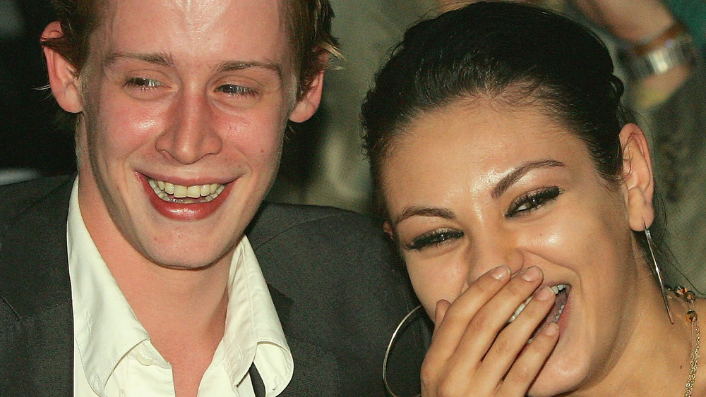 Mila Kunis and Macaulay Culkin enjoy a laugh