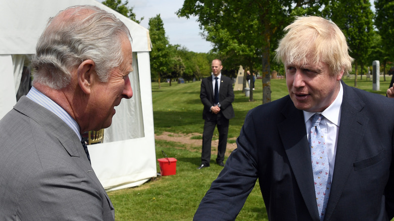 Prince Charles and Boris Johnson shaking hands