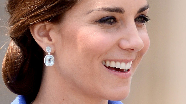 Kate Middleton in side profile with wide smile