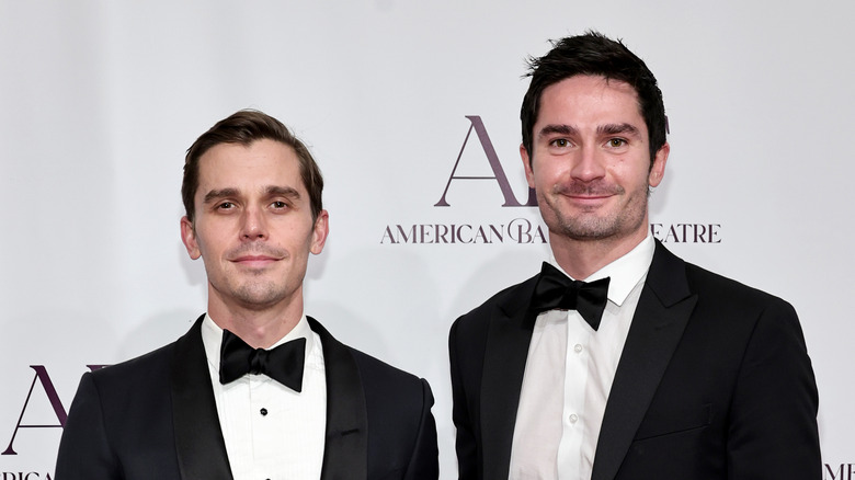 Antoni Porowski and Kevin Harrington posing at an event