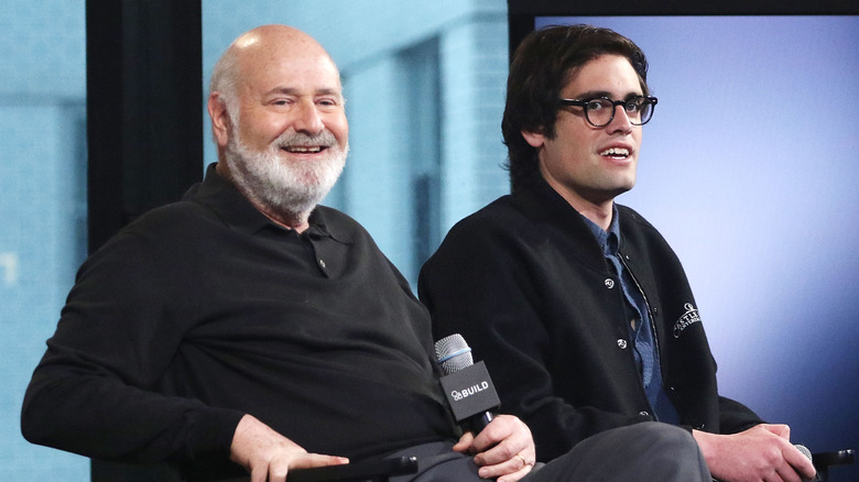 Rob and Nick Reiner smiling with microphones