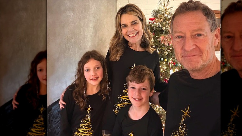 Savannah Guthrie with husband and children and Christmas tree