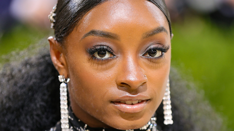 Simone Biles smiling and looking fierce at the 2021 Met Gala