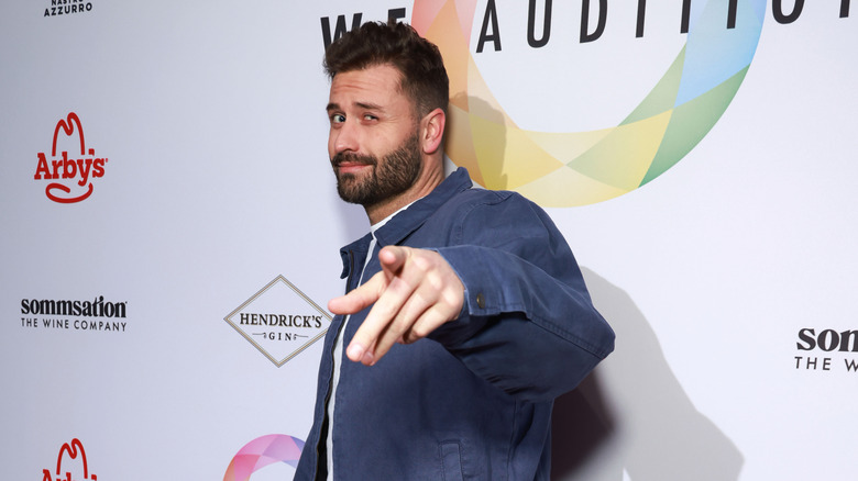 Dakota Mortensen points at a camera