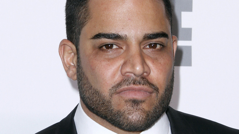 Mike Shouhed with serious face on red carpet 
