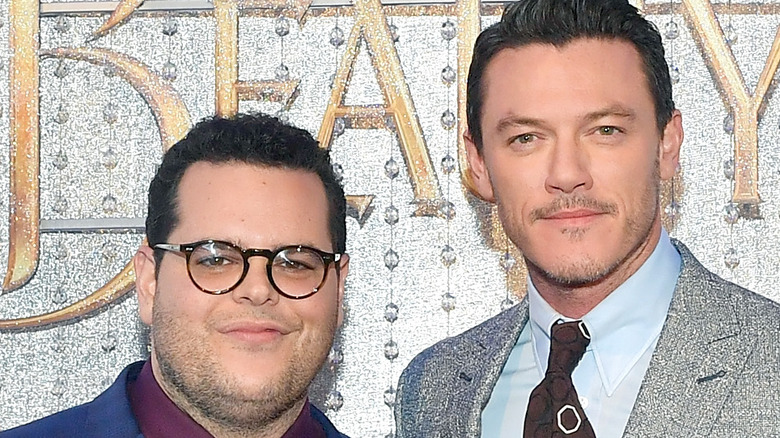 Luke Evans and Josh Gad posing