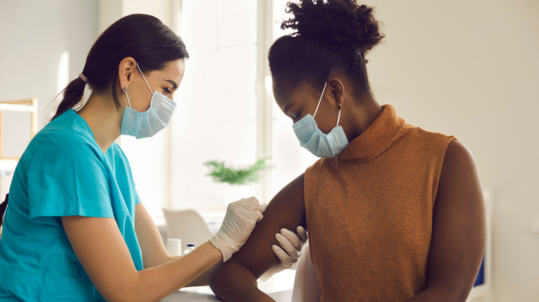 woman getting vaccine