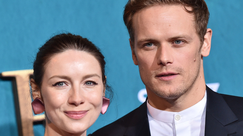 Sam Heughan and Caitriona Balfe at an event 