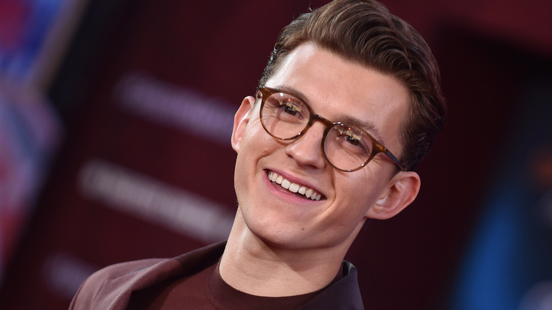 Tom Holland wearing glasses