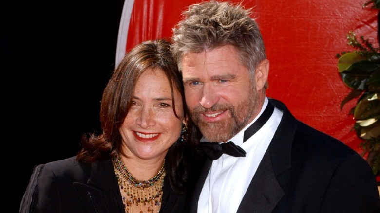 Pam Van Sant and Treat Williams leaning close
