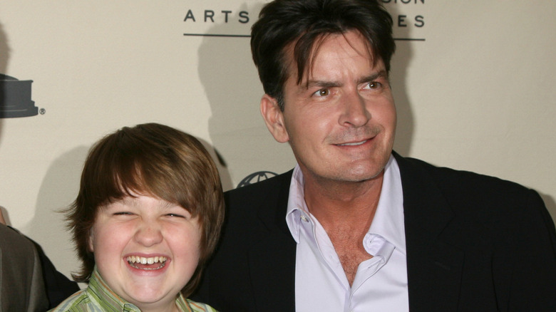 Angus T. Jones and Charlie Sheen on the red carpet