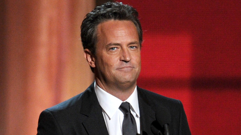 Matthew Perry smirking