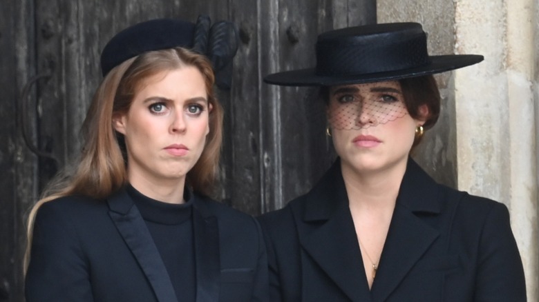 Princess Beatrice and Princess Eugenie frowning