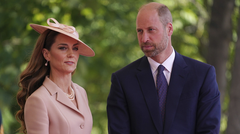 Princess Catherine and Prince William standing next to each other