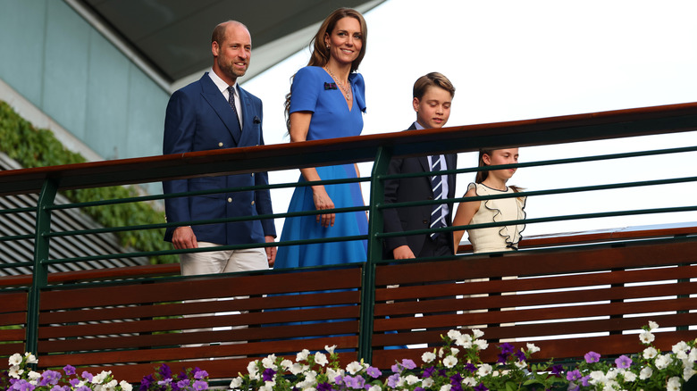 Princess Catherine and Prince William walking with Prince George and Princess Charlotte